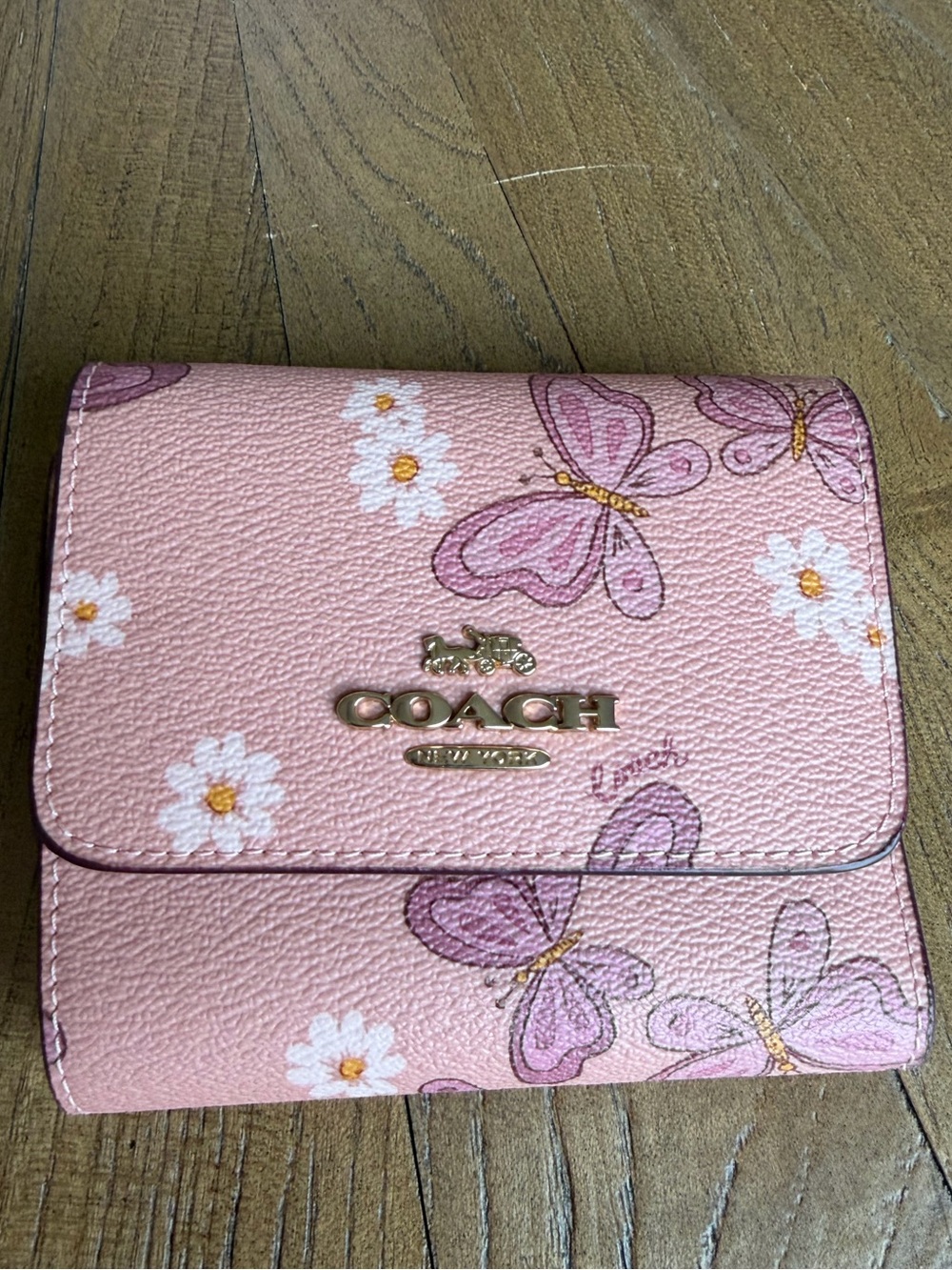 Coach Small Trifold Wallet featuring a lovely butterfly and daisy print